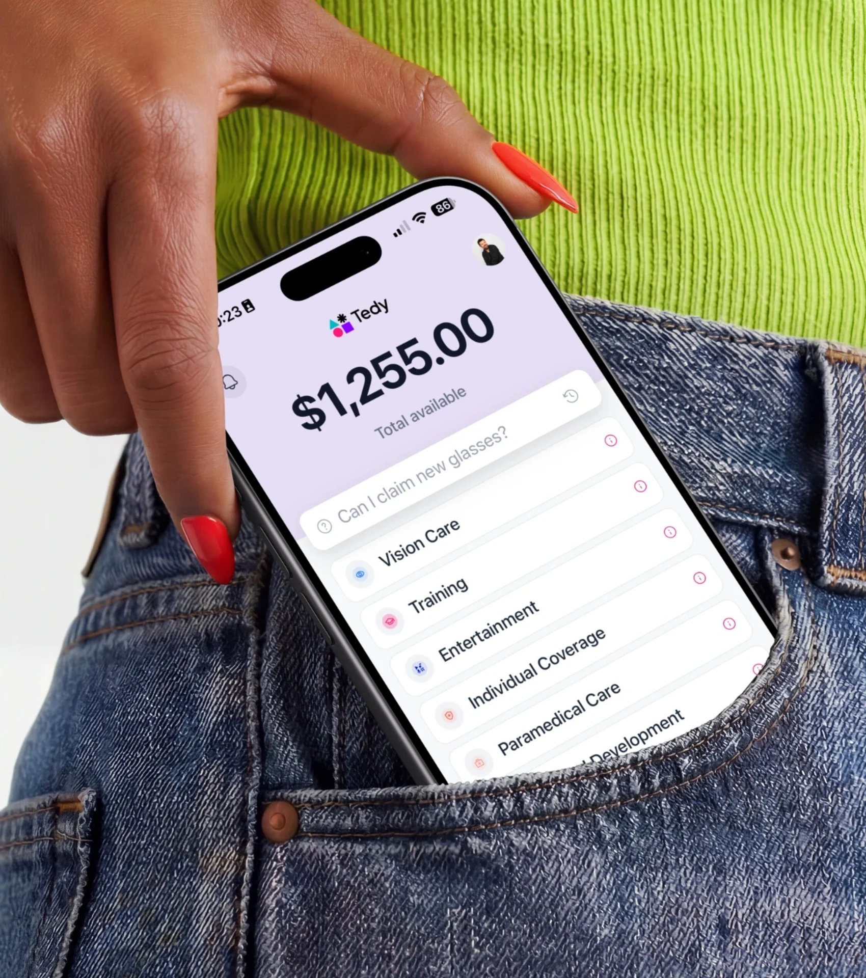 Employee checking a $1,255 Tedy balance on the phone in their jeans pocket.