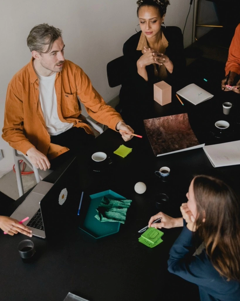 HR team collaborating around a meeting table