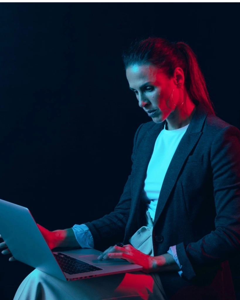 HR professional reviewing employee data on a laptop