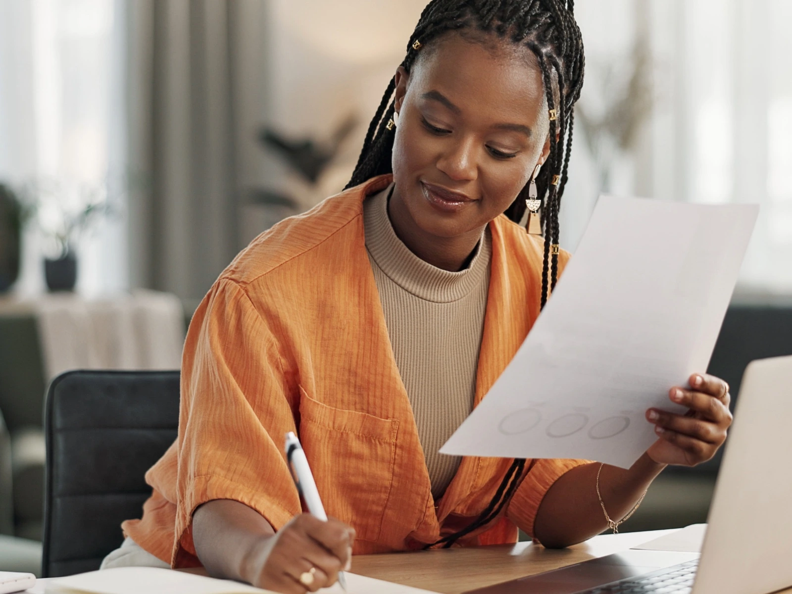 Professional preparing client documents at a desk